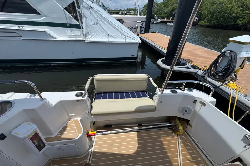 Slide: The Image of 2020 Ranger Tugs R-31 CB boat cockpit with seating and dock view. - 10