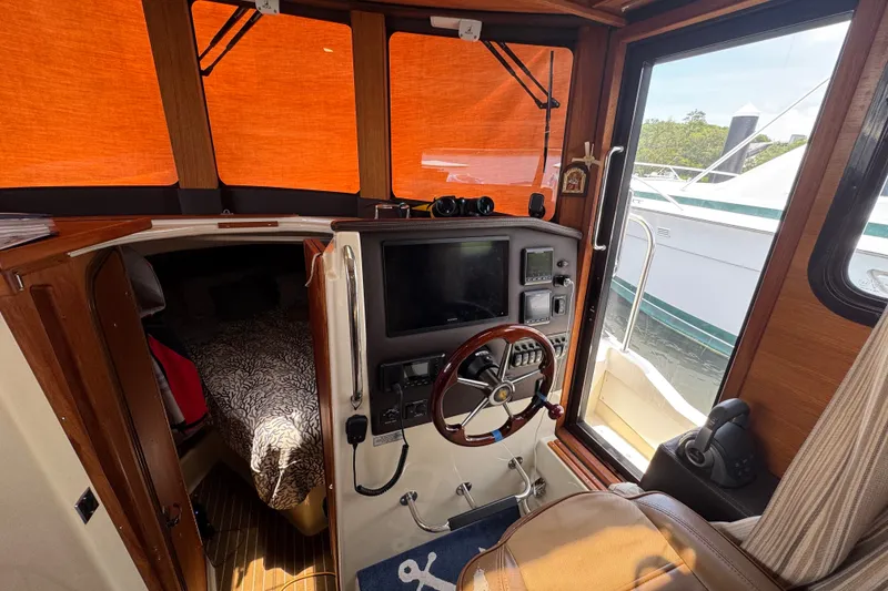 Slide: The Image of Interior of a 2020 Ranger Tugs R-31 CB boat with helm and cabin view. - 23