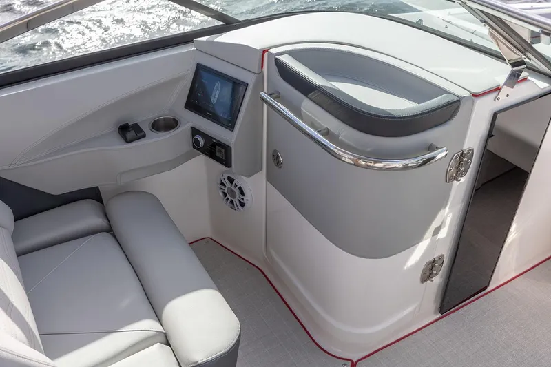 Slide: The Image of Manufacturer Provided Image: 2026 Regal LX6 boat interior with modern dashboard and seating. - 11