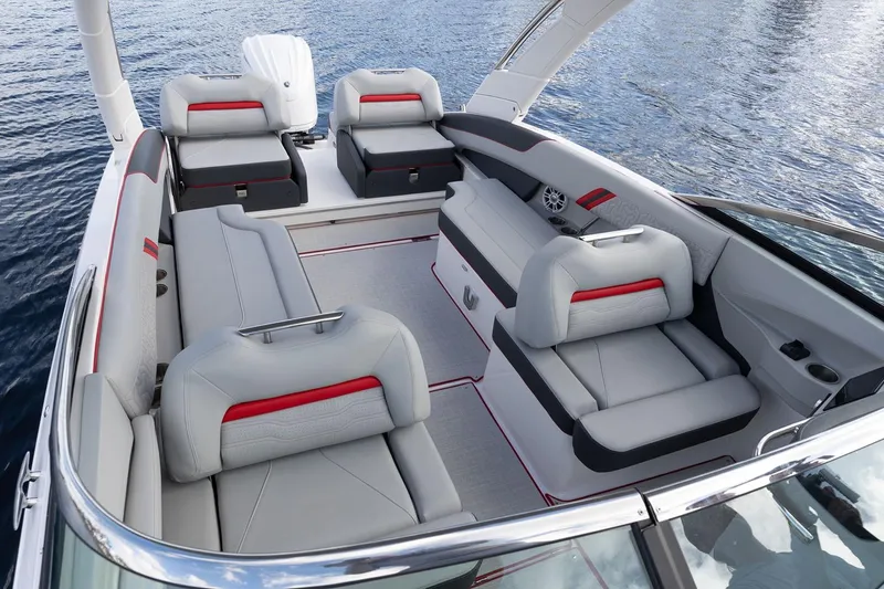 Slide: The Image of Manufacturer Provided Image: 2026 Regal LX6 boat interior with luxurious seating on calm water. - 13
