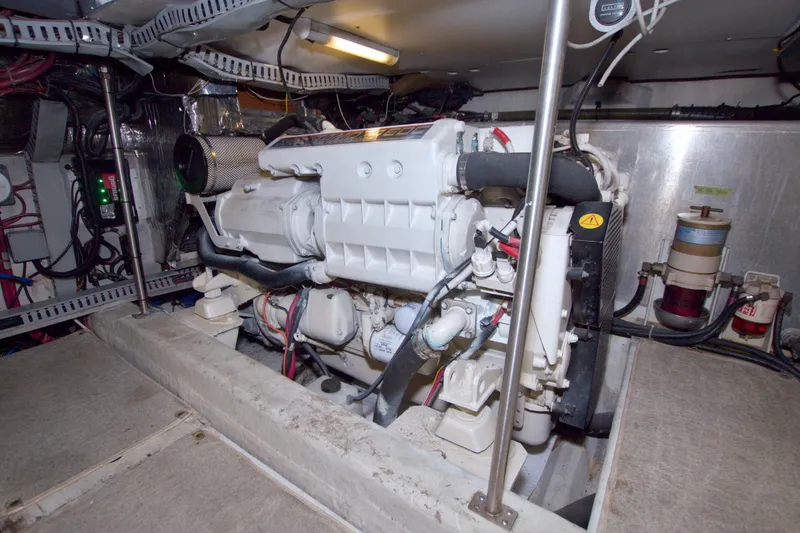 Slide: The Image of Engine room of 2001 Carver 466 Motor Yacht, showcasing mechanical components and wiring. - 80