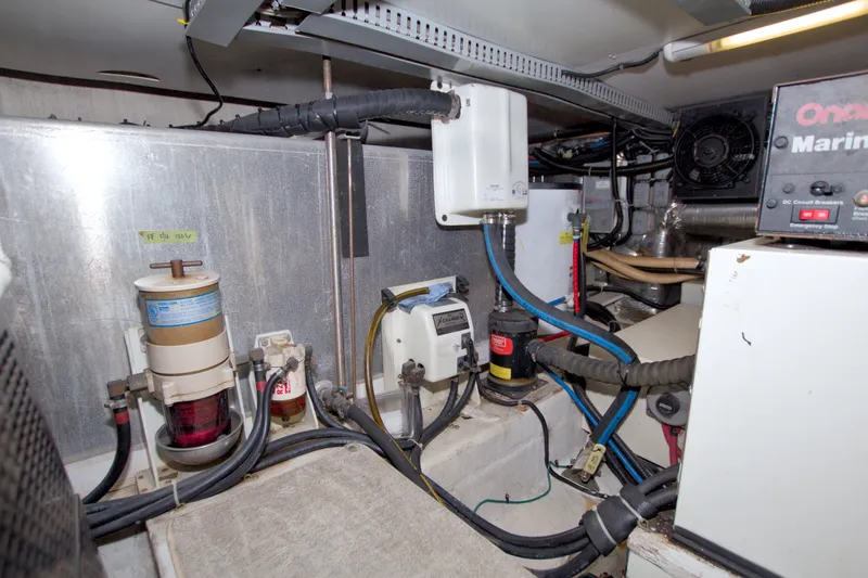 Slide: The Image of Engine room of 2001 Carver 466 Motor Yacht with various mechanical components. - 82