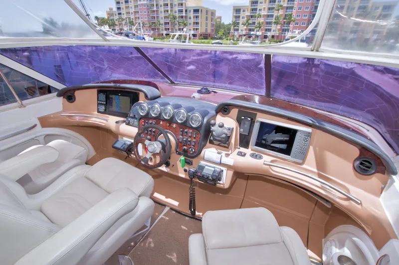 Slide: The Image of Luxurious helm of 2001 Carver 466 Motor Yacht with modern navigation equipment. - 21