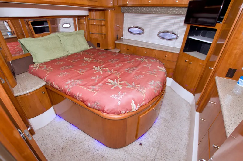 Slide: The Image of Luxurious bedroom interior of 2001 Carver 466 Motor Yacht with elegant wood finishes. - 59