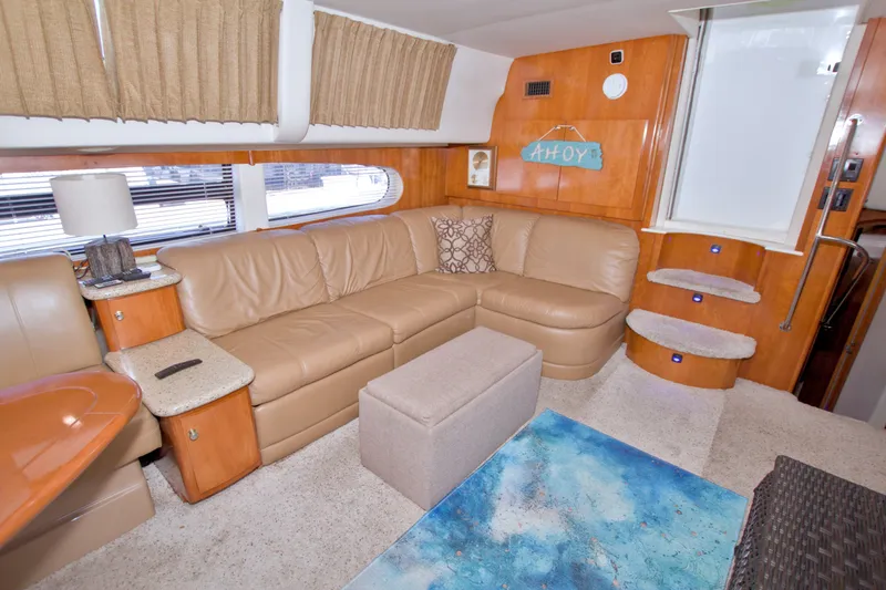 Slide: The Image of Luxurious interior of 2001 Carver 466 Motor Yacht with beige leather seating. - 35