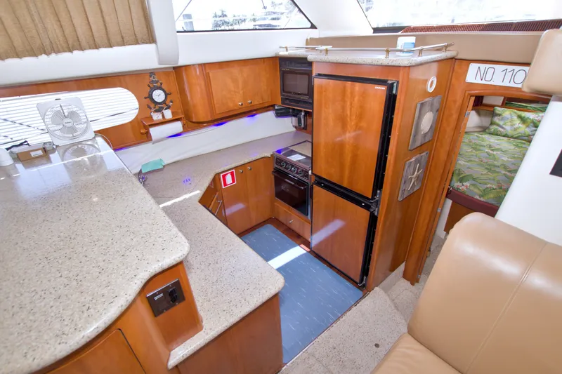 Slide: The Image of Interior of 2001 Carver 466 Motor Yacht with kitchen and cozy seating area. - 37