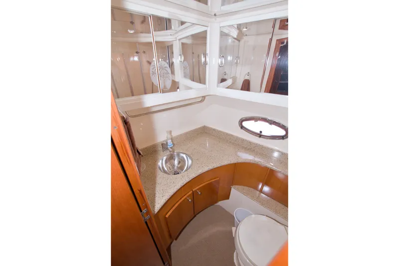 Slide: The Image of Luxurious bathroom in 2001 Carver 466 Motor Yacht with modern fixtures and elegant design. - 63