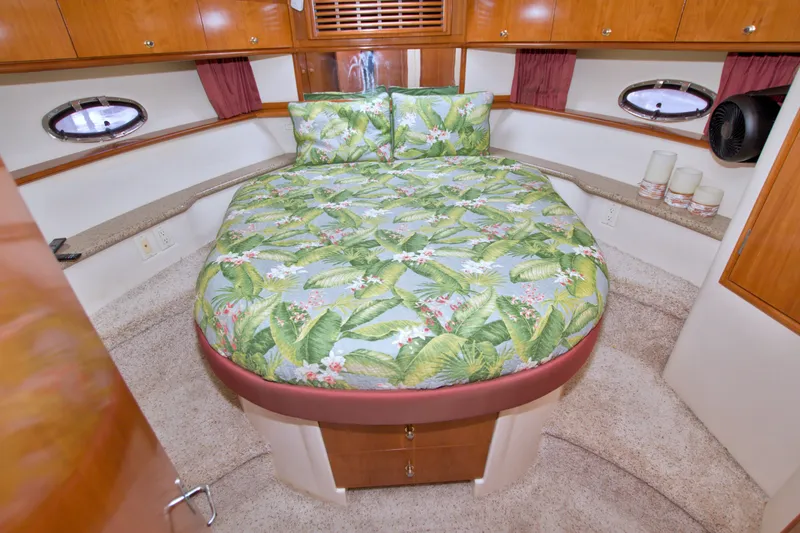 Slide: The Image of Luxurious bedroom interior of 2001 Carver 466 Motor Yacht with tropical bedding. - 41