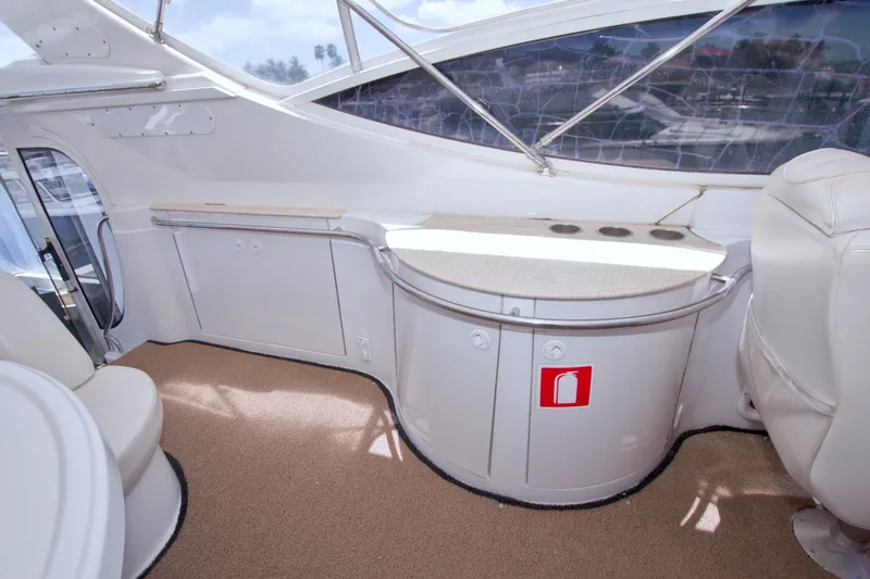 Slide: The Image of Interior of 2001 Carver 466 Motor Yacht with seating and storage area. - 28