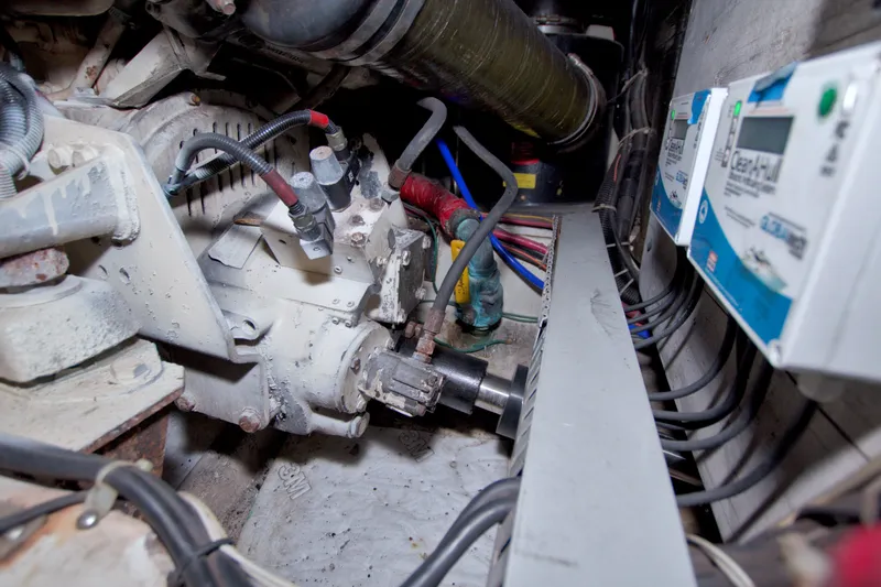Slide: The Image of Engine room of 2001 Carver 466 Motor Yacht, showcasing mechanical components and wiring. - 73