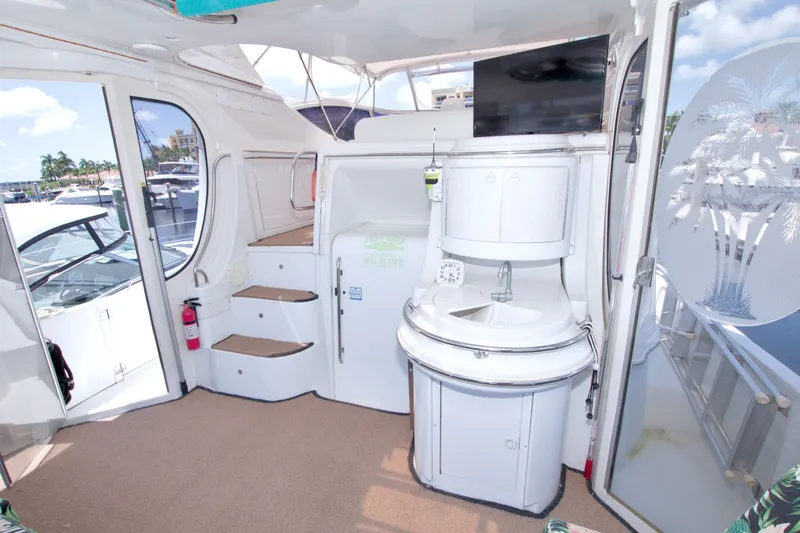 Slide: The Image of 2001 Carver 466 Motor Yacht interior with sink, stairs, and etched glass door. - 8