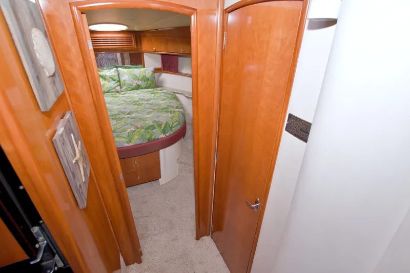 Slide: The Image of Interior of 2001 Carver 466 Motor Yacht with cozy bedroom and wooden finishes. - 40