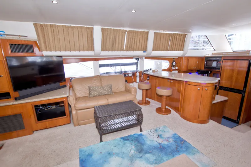 Slide: The Image of Luxurious interior of 2001 Carver 466 Motor Yacht with leather seating and modern amenities. - 36