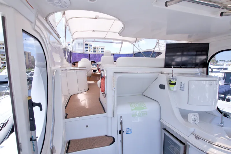 Slide: The Image of 2001 Carver 466 Motor Yacht interior with modern amenities and spacious seating. - 17