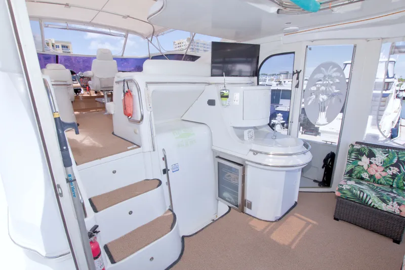 Slide: The Image of Interior of 2001 Carver 466 Motor Yacht with seating, sink, and helm station. - 16