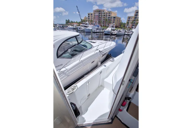Slide: The Image of 2001 Carver 466 Motor Yacht docked at marina with other boats. - 9