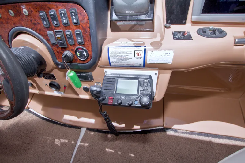 Slide: The Image of Control panel of a 2001 Carver 466 Motor Yacht with navigation equipment. - 24