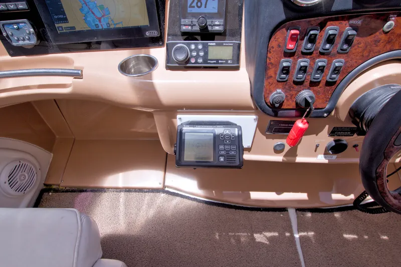 Slide: The Image of Dashboard of a 2001 Carver 466 Motor Yacht with navigation controls and instruments. - 27