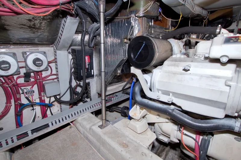 Slide: The Image of Engine room of a 2001 Carver 466 Motor Yacht with wiring and machinery. - 76