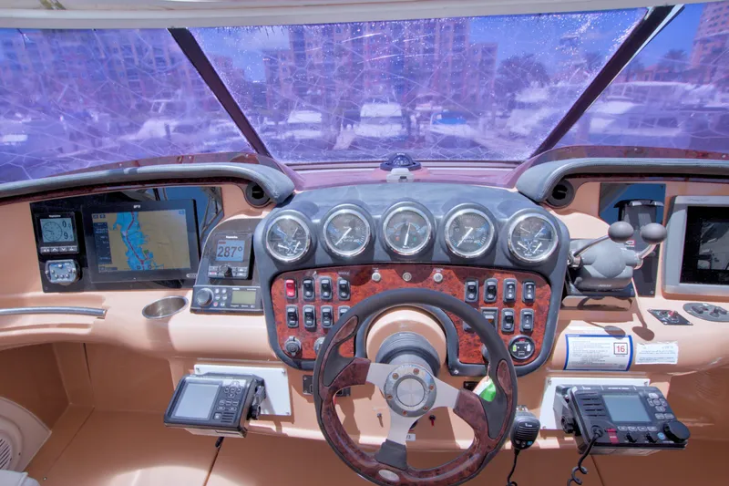 Slide: The Image of Cockpit of 2001 Carver 466 Motor Yacht with navigation instruments and steering wheel. - 25