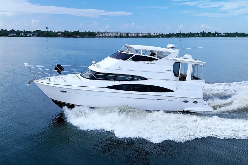 The Image of 2001 Carver 466 Motor Yacht cruising on calm waters under a clear sky. - 0