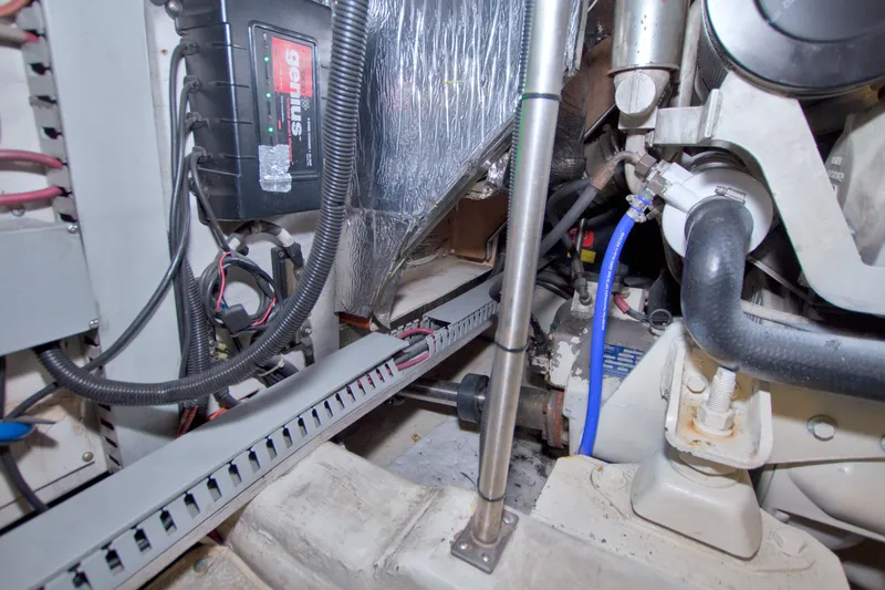 Slide: The Image of Engine room of a 2001 Carver 466 Motor Yacht, showcasing wiring and components. - 77