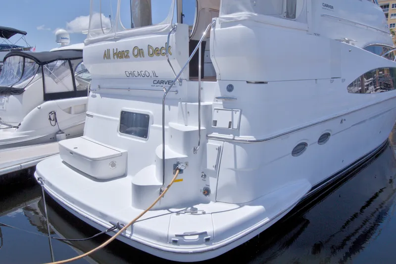 Slide: The Image of 2001 Carver 466 Motor Yacht docked, featuring "All Hanz On Deck" signage, Chicago, IL. - 5