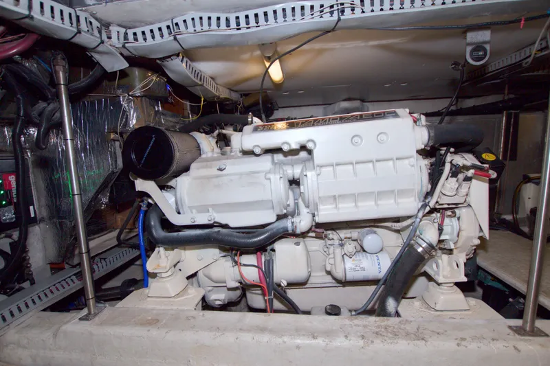 Slide: The Image of Engine room of 2001 Carver 466 Motor Yacht, showcasing mechanical components and wiring. - 79