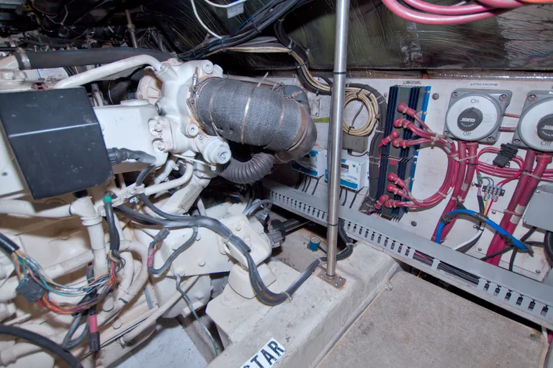 Slide: The Image of Engine room of 2001 Carver 466 Motor Yacht with wiring and mechanical components. - 72