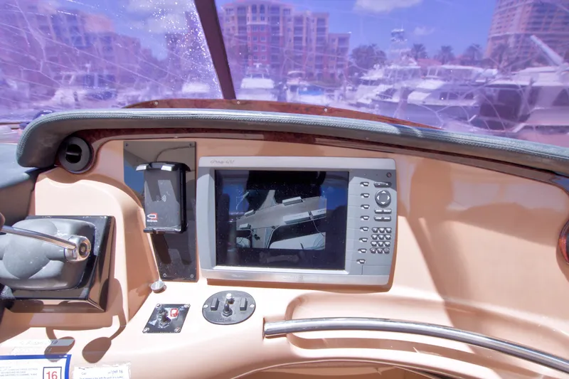 Slide: The Image of Helm of 2001 Carver 466 Motor Yacht with navigation equipment and controls. - 23