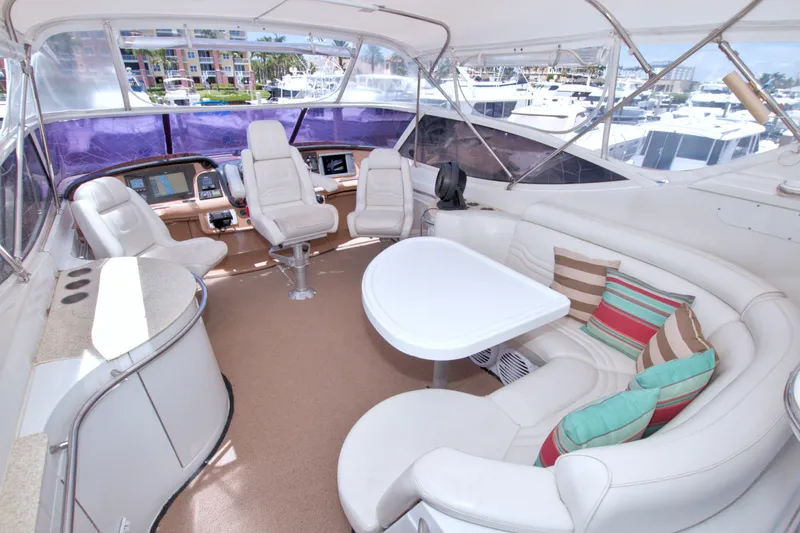 Slide: The Image of Luxurious interior of 2001 Carver 466 Motor Yacht with plush seating and helm station. - 18