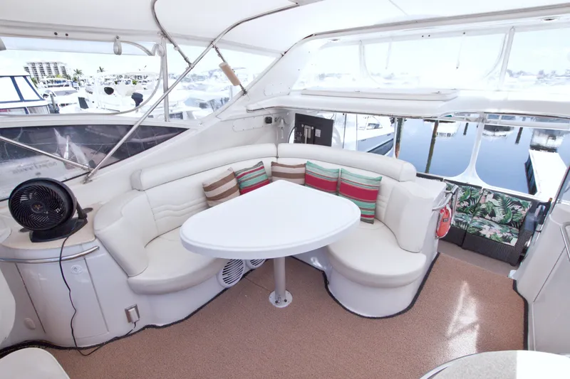 Slide: The Image of Luxurious interior of 2001 Carver 466 Motor Yacht with plush seating and table. - 19