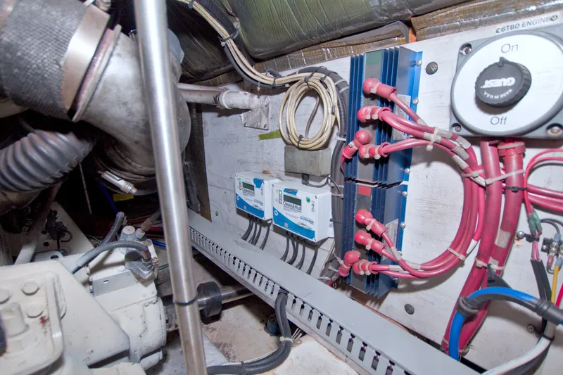Slide: The Image of Engine room of 2001 Carver 466 Motor Yacht with wiring and control systems. - 74