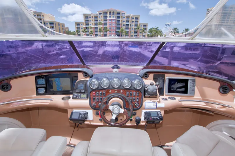 Slide: The Image of Interior view of 2001 Carver 466 Motor Yacht helm with navigation equipment and controls. - 22
