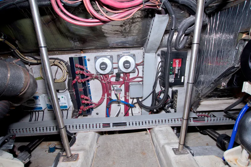 Slide: The Image of Engine room of 2001 Carver 466 Motor Yacht with wiring and control panels. - 75