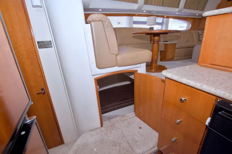 Slide: The Image of Interior of 2001 Carver 466 Motor Yacht with seating and wooden cabinetry. - 51