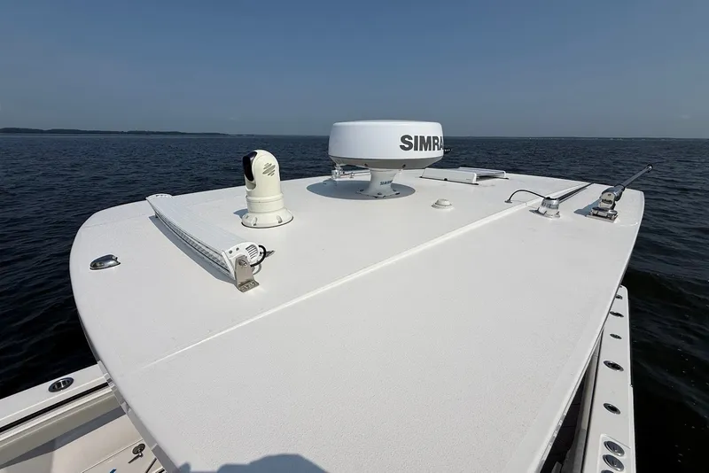 Slide: The Image of 2023 Reef Runner 34CC boat with radar and navigation equipment on open water. - 29