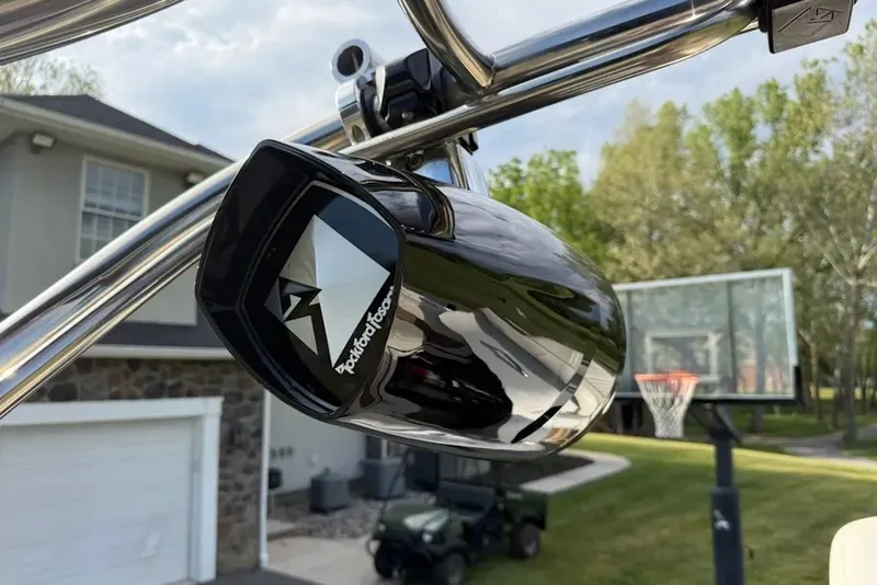 Slide: The Image of Rockford Fosgate speaker mounted on a 2008 Cobalt 252 boat, with basketball hoop in background. - 21