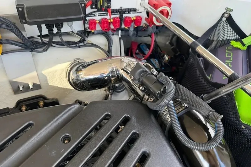 Slide: The Image of Engine compartment of a 2008 Cobalt 252 boat, featuring wiring and components. - 22