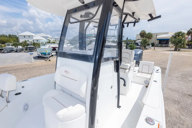 Slide: The Image of 2019 Sea Hunt BX25FS boat with center console and seating, docked outdoors. - 40