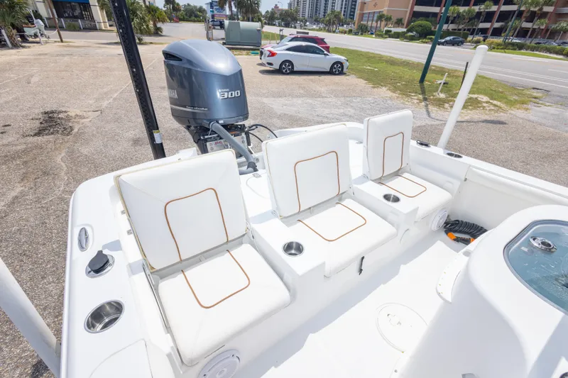 Slide: The Image of 2019 Sea Hunt BX25FS boat with Yamaha 300 engine, featuring white seating and cup holders. - 34