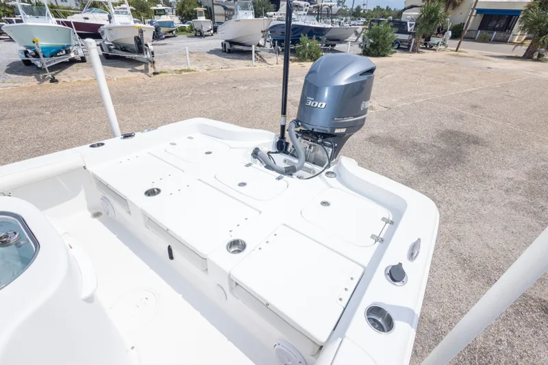 Slide: The Image of 2019 Sea Hunt BX25FS boat with Yamaha 300 engine, parked in a marina. - 33