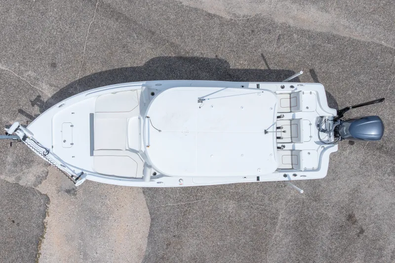 Slide: The Image of Overhead view of a 2019 Sea Hunt BX25FS boat on concrete surface. - 11