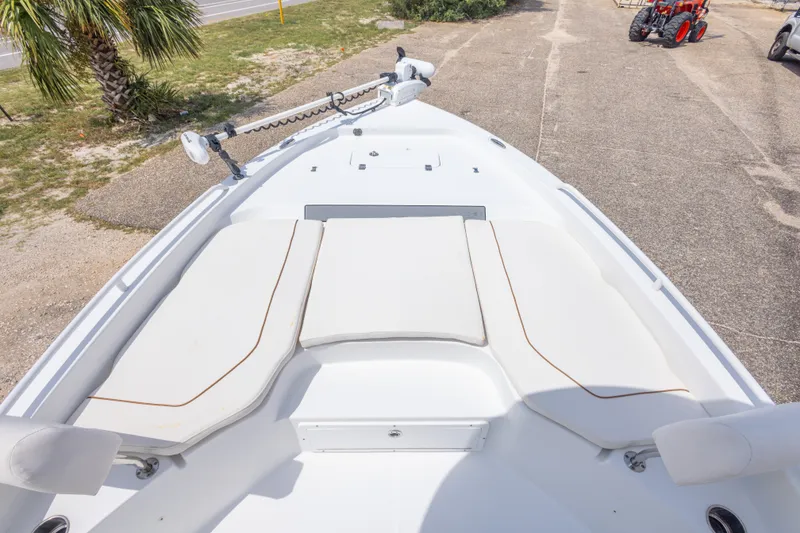 Slide: The Image of 2019 Sea Hunt BX25FS boat bow with cushioned seating and trolling motor. - 25