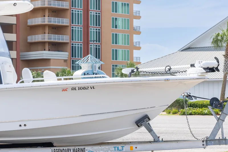 Slide: The Image of 2019 Sea Hunt BX25FS boat on trailer, urban background, sunny day. - 5