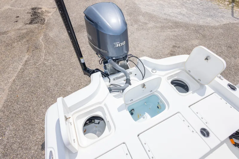 Slide: The Image of 2019 Sea Hunt BX25FS boat with Yamaha 300 engine and open storage compartments. - 32