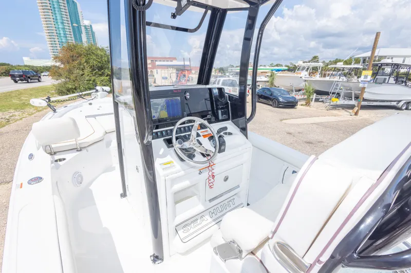 Slide: The Image of 2019 Sea Hunt BX25FS boat interior with steering console and navigation equipment. - 50