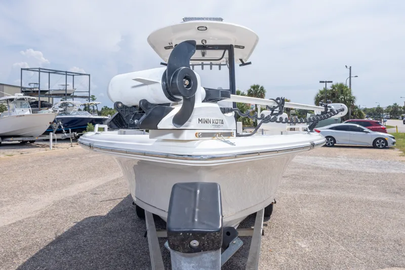 Slide: The Image of 2019 Sea Hunt BX25FS boat with Minn Kota trolling motor, parked outdoors. - 54