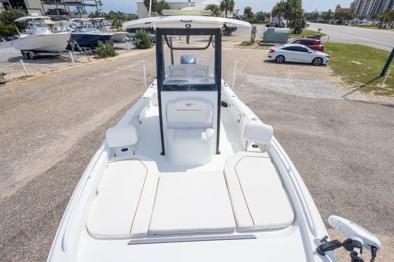 Slide: The Image of 2019 Sea Hunt BX25FS boat with spacious deck and seating, parked on a lot. - 44