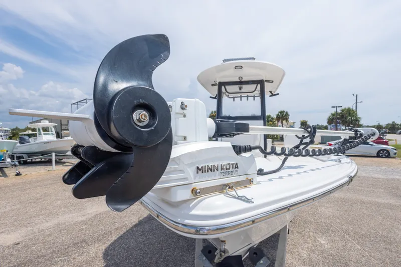 Slide: The Image of 2019 Sea Hunt BX25FS boat with Minn Kota Terrova trolling motor, docked outdoors. - 20